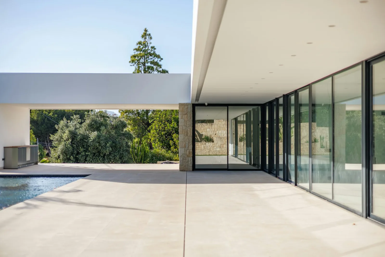 Glass sliding doors and windows on a single-storey house